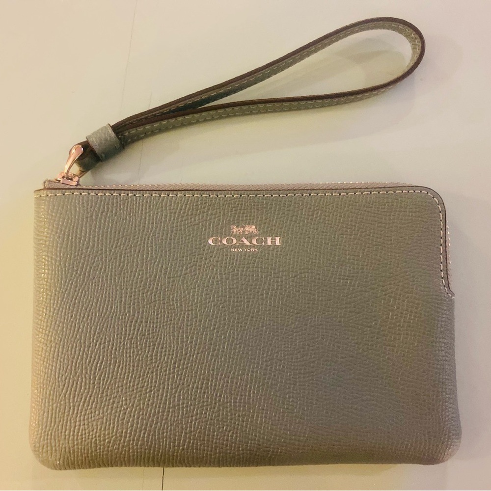 NWT Coach light green corner zip wristlet.